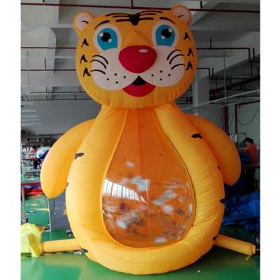 Custom giant inflatable tiger shape money grabbing machine for outdoor game